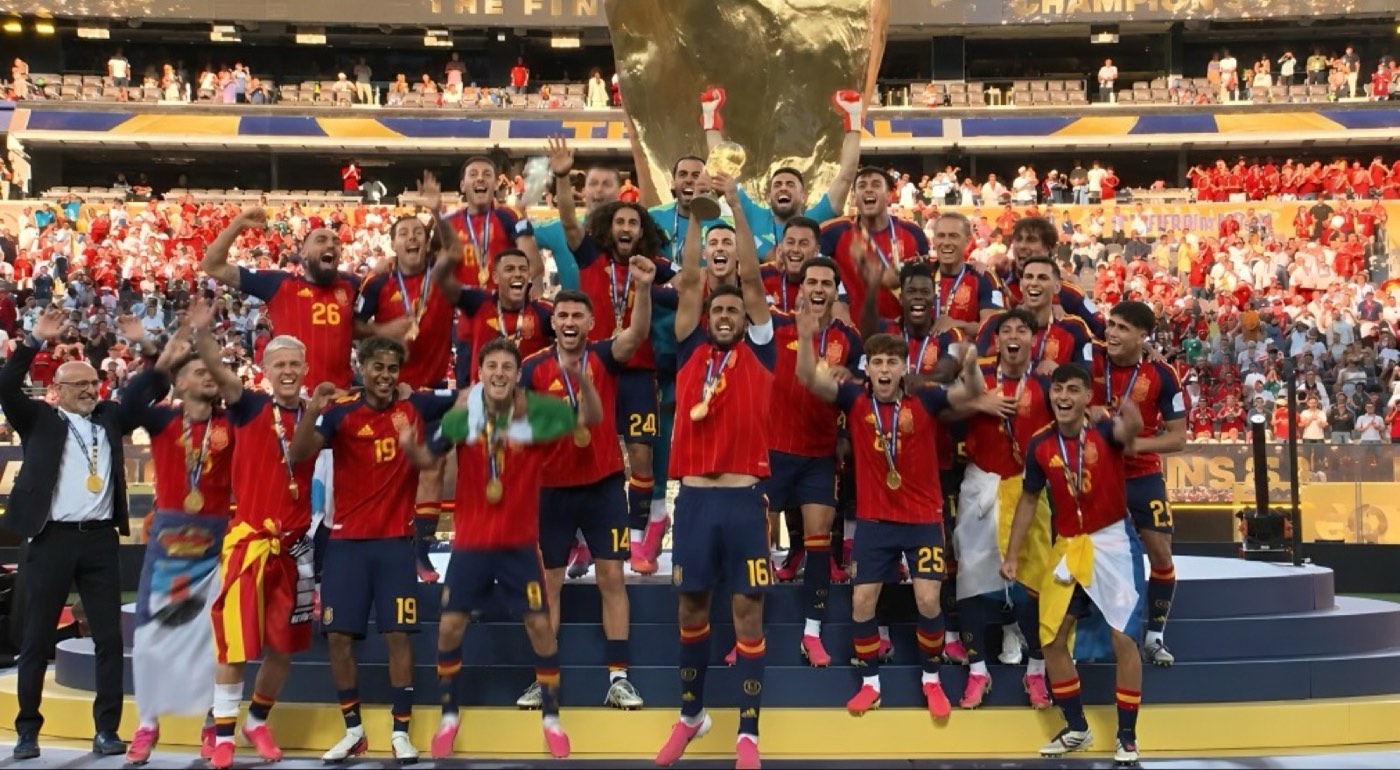 The Spain squad celebrating on the podium with the World Cup trophy